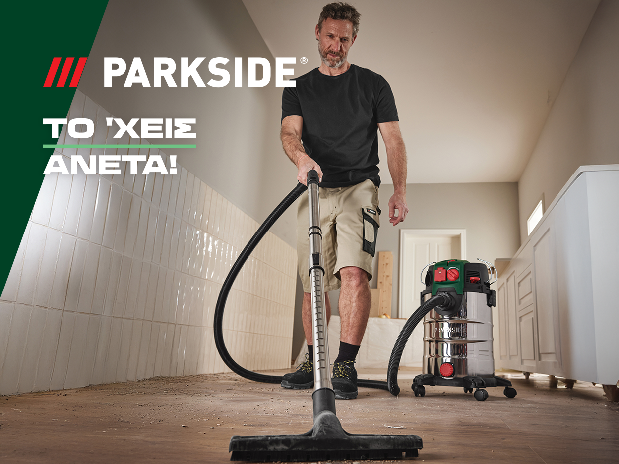 Ένας άντρας χρησιμοποιεί ηλεκτρική σκούπα Parkside για να καθαρίσει ένα δωμάτιο.