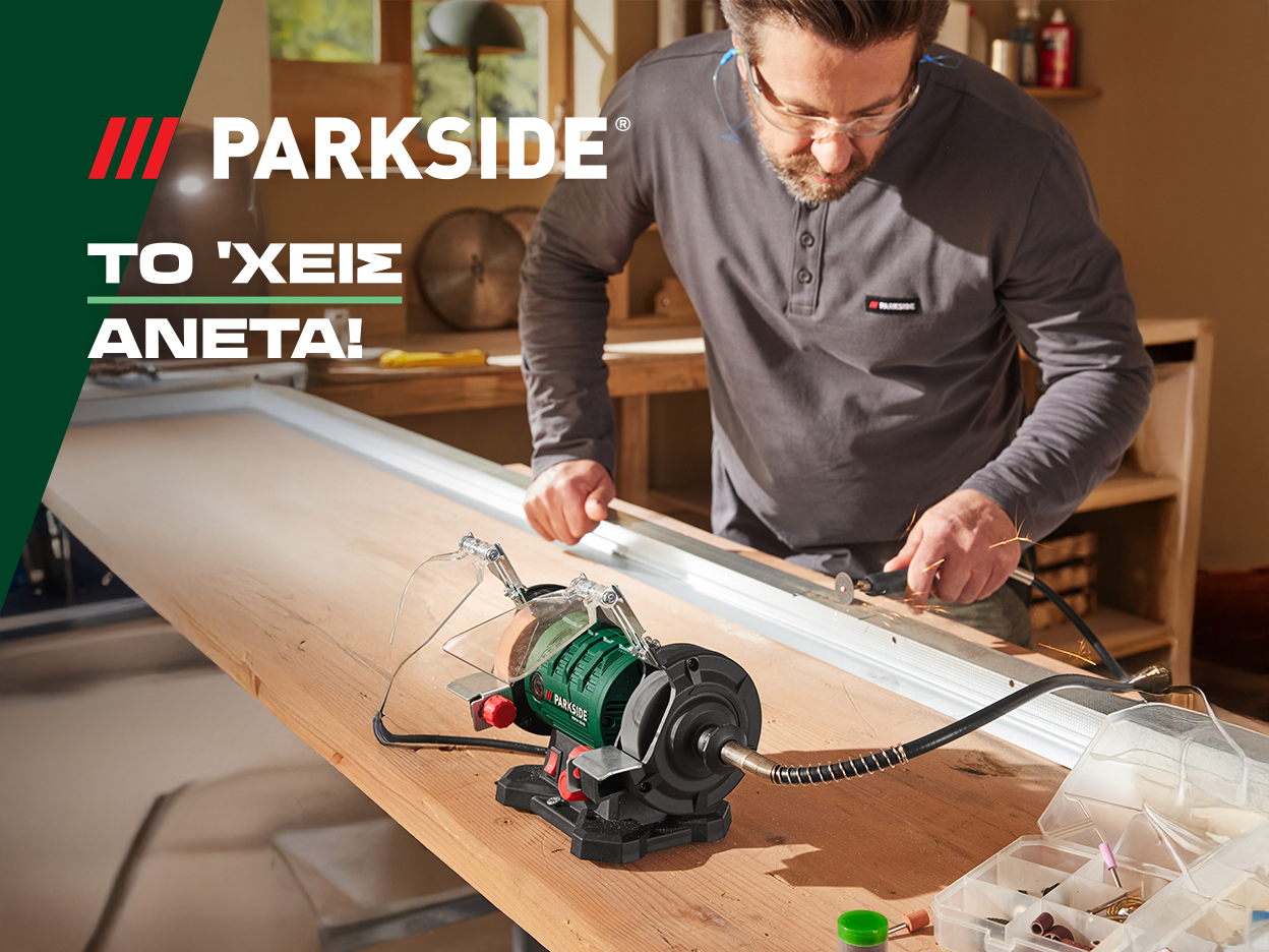 Ένας άνδρας χρησιμοποιεί ένα εργαλείο Parkside για να κόψει μέταλλο σε ένα ξύλινο τραπέζι.
