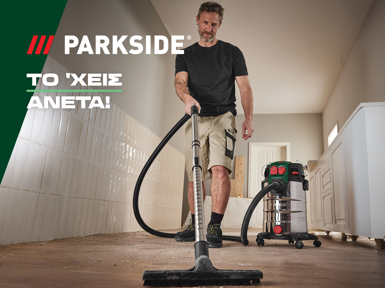 Ένας άντρας χρησιμοποιεί ηλεκτρική σκούπα Parkside για να καθαρίσει ένα δωμάτιο.