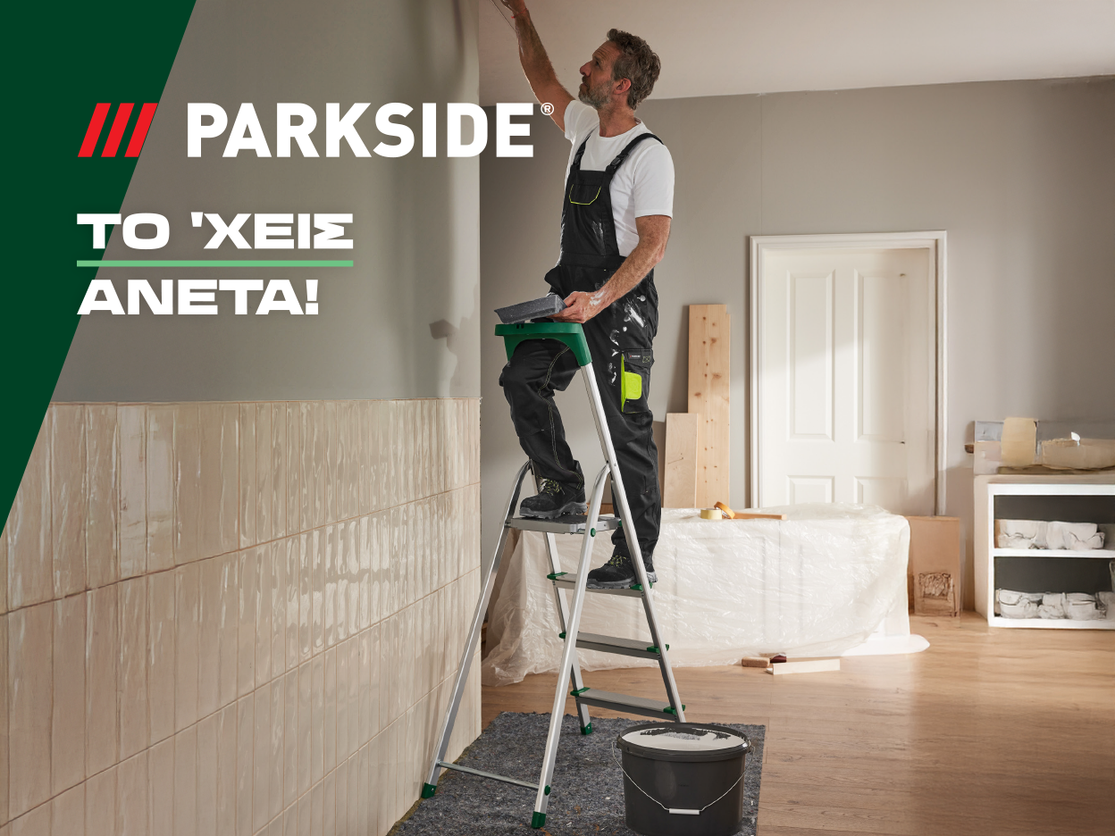 Ένας άντρας χρησιμοποιεί σκάλα Parkside για να βάψει έναν τοίχο.
