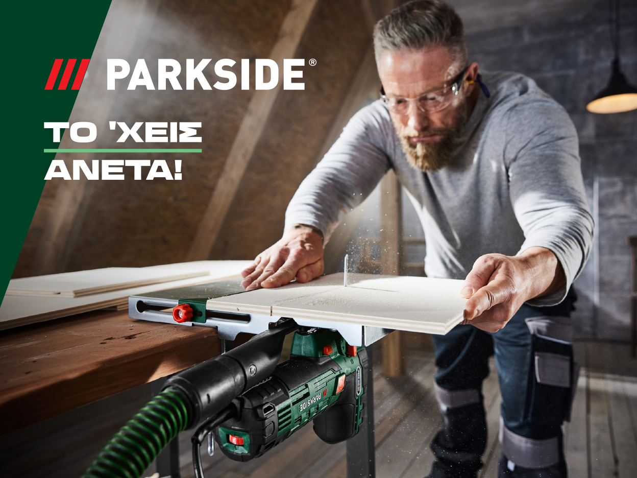 Ένας άντρας χρησιμοποιεί ένα πριόνι Parkside για να κόψει ξύλο.
